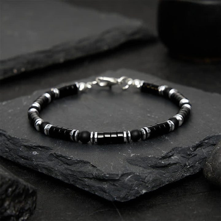 Buddha Stones Armband met cilindrische, matte zwarte onyx tussenkraaltjes - image 1