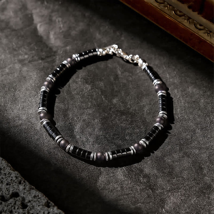 Buddha Stones Armband met cilindrische, matte zwarte onyx tussenkraaltjes - image 2