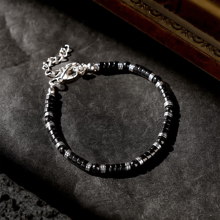 Buddha Stones Armband met cilindrische, matte zwarte onyx tussenkraaltjes - image 11