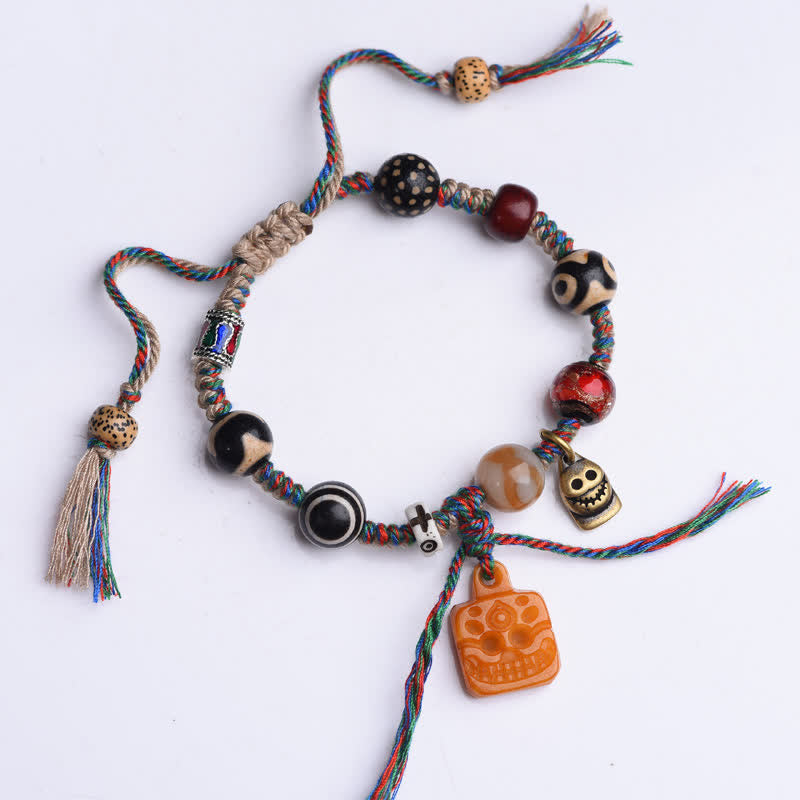 Buddha Stones Tibetaanse Dzi kralenarmband van been, gevlochten, veelkleurig Armband , met zegeningen. - image 1