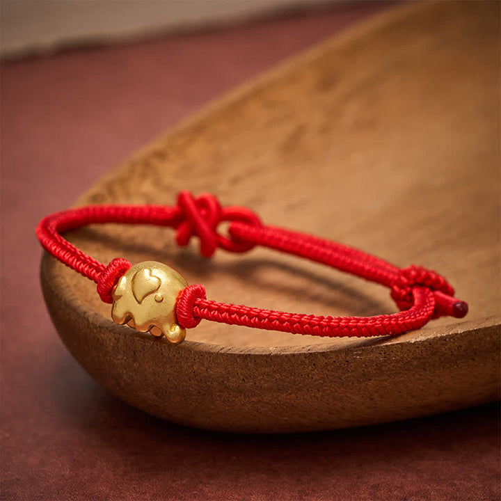 Buddha Stones Rode Armband met olifantje en koperen bescherming - image 1