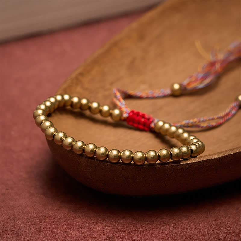 Buddha Stones Balansarmband met koperen kralen en rood Armband - image 1
