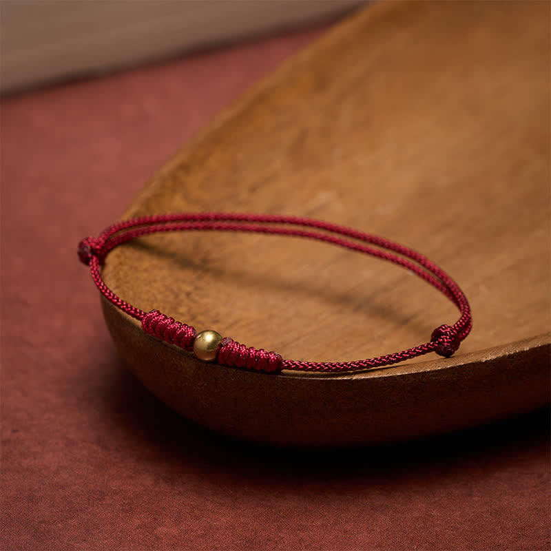 Buddha Stones Rode koord Armband met koperen kralen - image 1