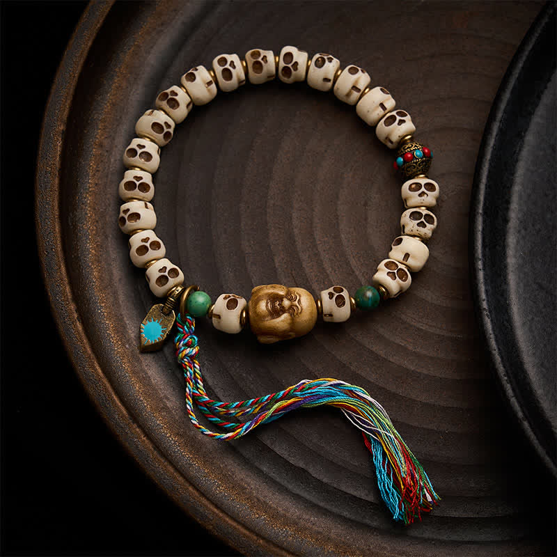 Buddha Stones Tibetaanse bottenkralen Heer van het Lijkenbos Schedelpatroon Armband voor Kracht en Verandering - 9 × 6,3 mm - image 0