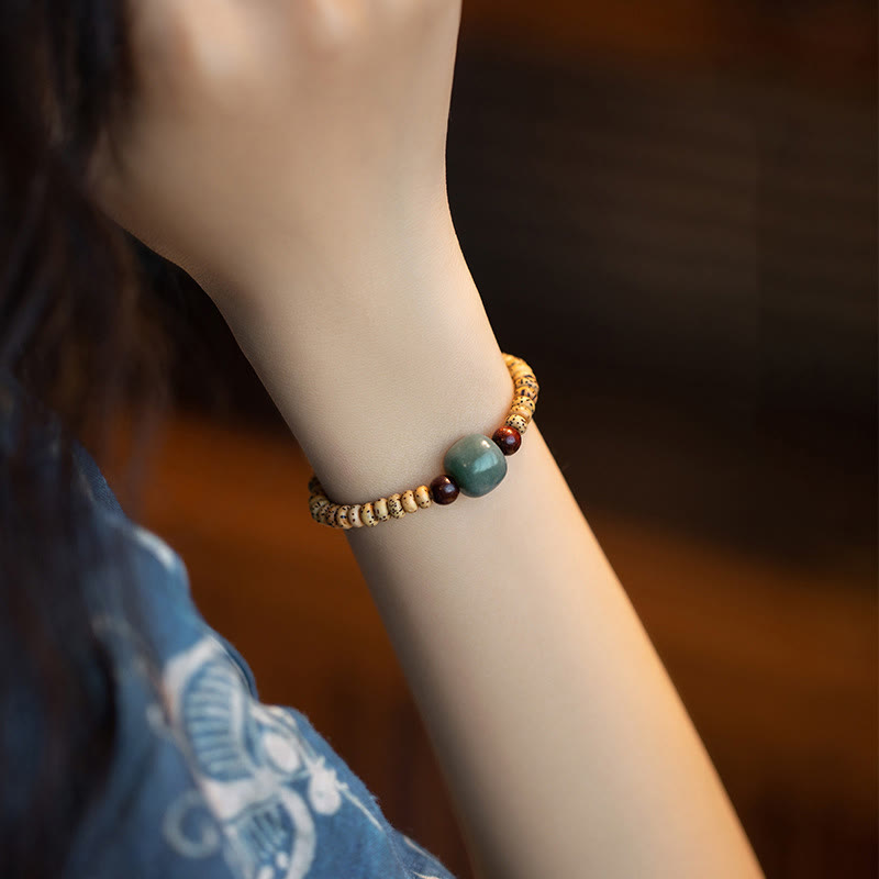 Buddha Stones Armband van Bodhizaad, kleine blaadjes en rood sandelhout. - image 3