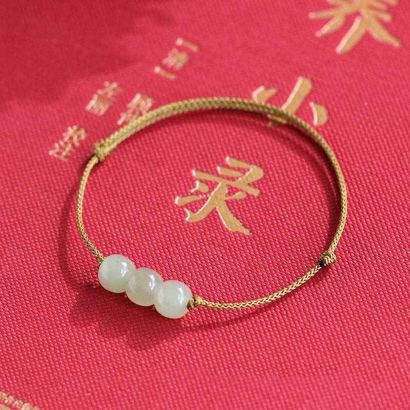 Buddha Stones Armband met drie jade kralen en gelukssymbool, geweven met een touwtje. - image 6