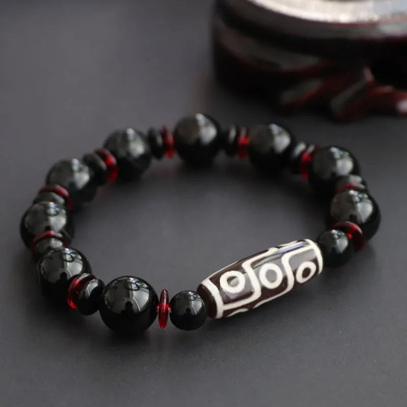 Buddha Stones Armband voor bescherming van rijkdom met negen zwarte onyx dzi-kralen - Zwarte onyx & negenoog Dzi-kraal - image 0