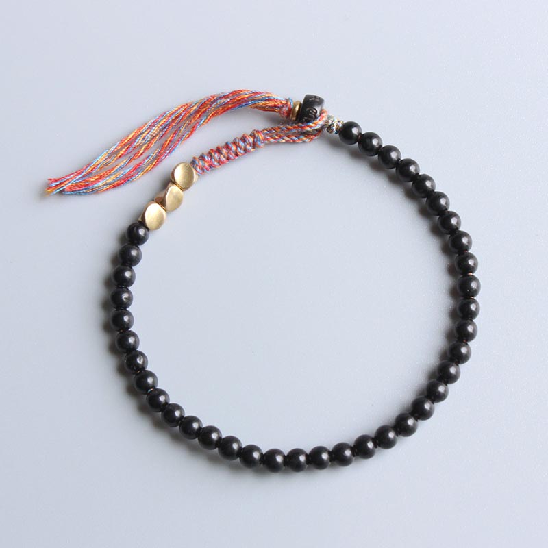 Buddha Stones Handgemaakte Tibetaanse Armband met kwastjes van zwarte onyx - image 0