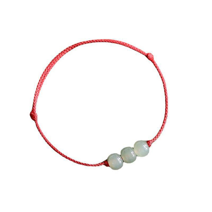 Buddha Stones Armband met drie jade kralen en gelukssymbool, geweven met een touwtje. - image 2