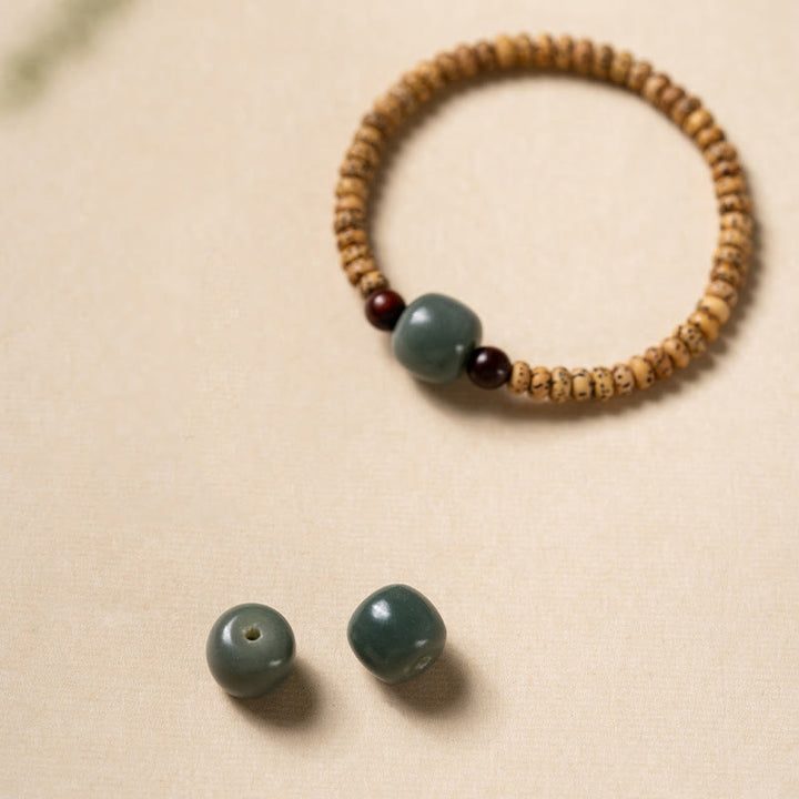 Buddha Stones Armband van Bodhizaad, kleine blaadjes en rood sandelhout. - image 7