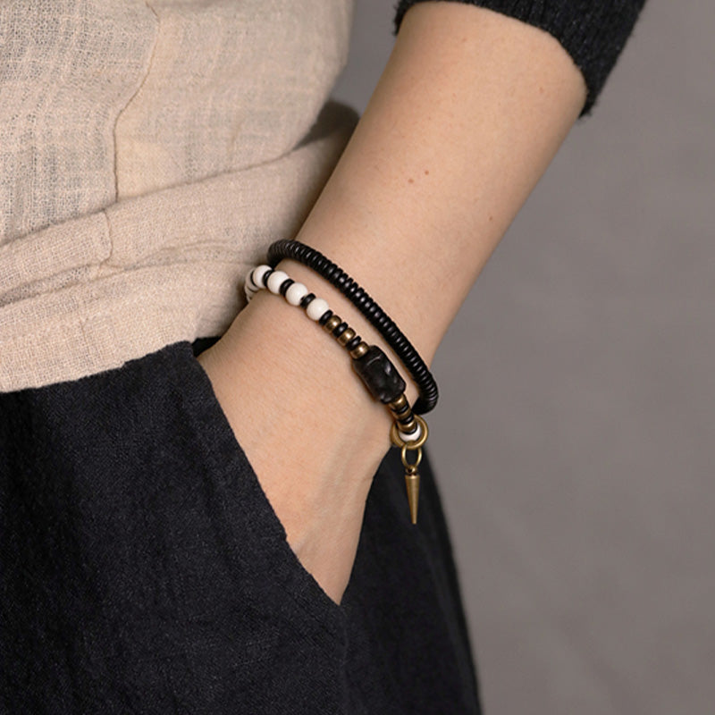 Buddha Stones Armband voor stellen, gemaakt van beenkralen, ebbenhout en koper. - image 3