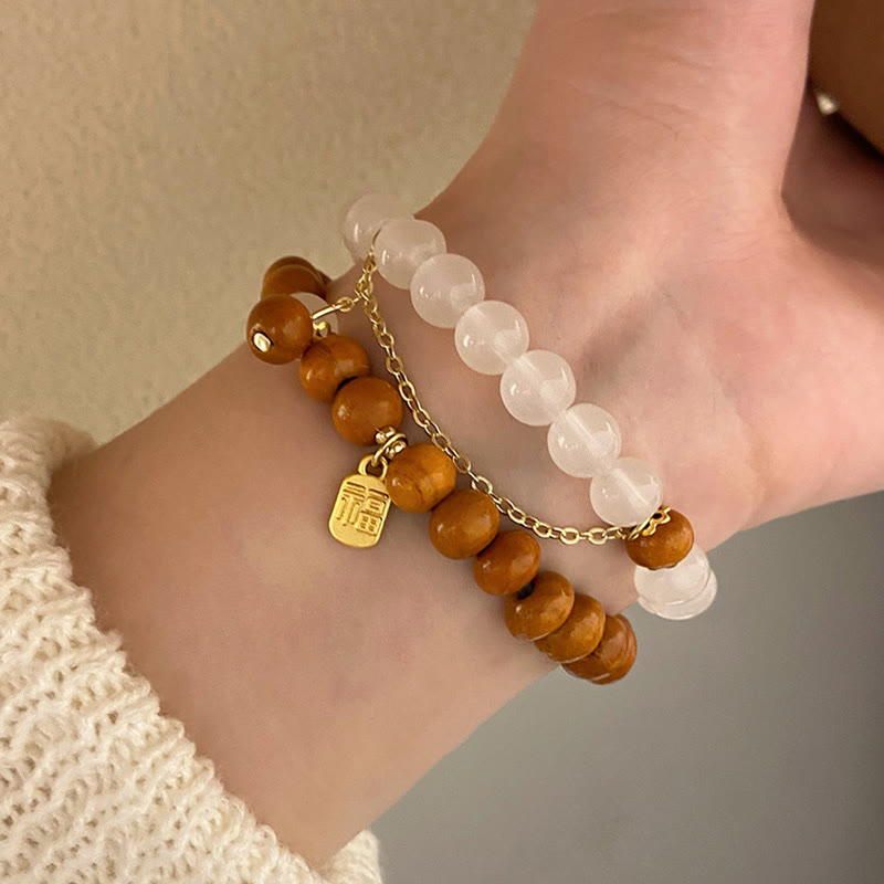 Buddha Stones Armband met bedeltje van sandelhout, kattenoog en Fu-figuur. - image 18