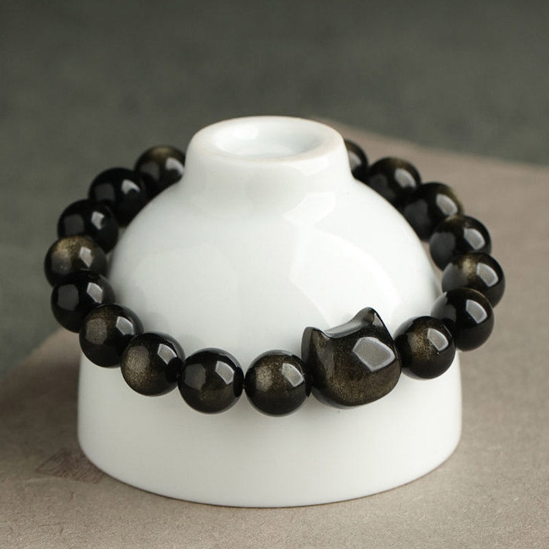 Buddha Stones Obsidiaan met gouden glans, obsidiaan met zilveren glans, geluksarmband met pootafdruk, Armband met katmotief. - image 1