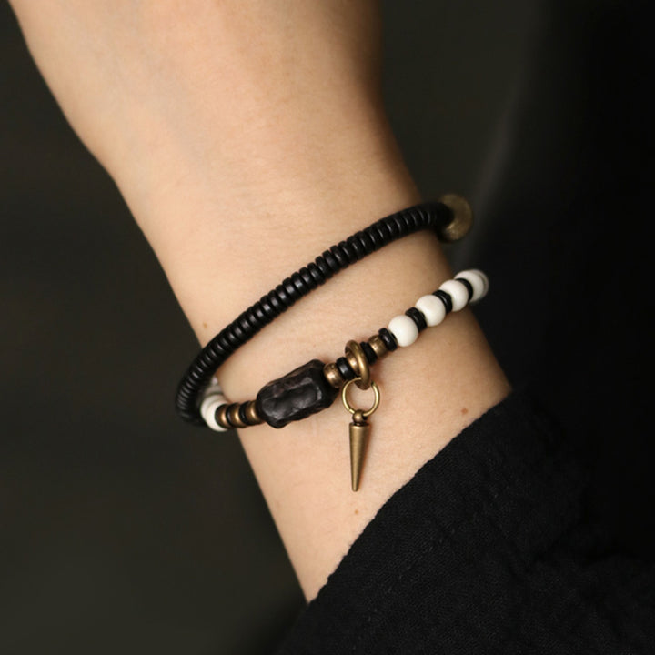 Buddha Stones Armband voor stellen, gemaakt van beenkralen, ebbenhout en koper. - image 4