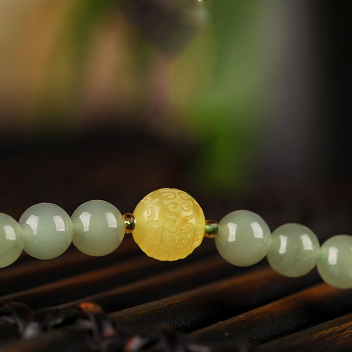 Buddha Stones Armband met lachende Boeddha, symbool van jade, rode agaat en amber. - image 8