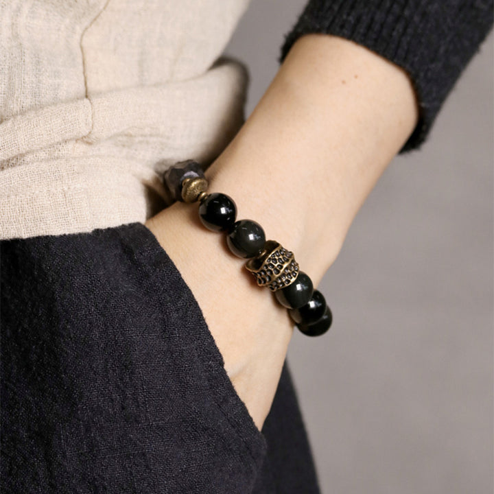 Buddha Stones Armband voor koppels, gemaakt van zwart obsidiaan, ebbenhout en koper. - image 2