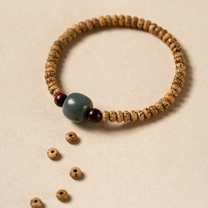 Buddha Stones Armband van Bodhizaad, kleine blaadjes en rood sandelhout. - image 4
