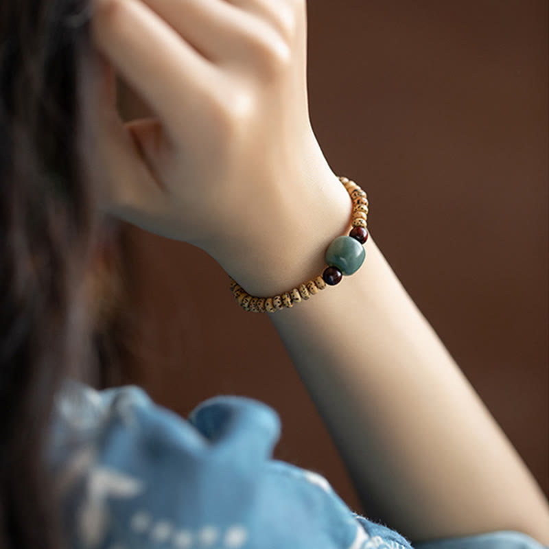 Buddha Stones Armband van Bodhizaad, kleine blaadjes en rood sandelhout. - image 9
