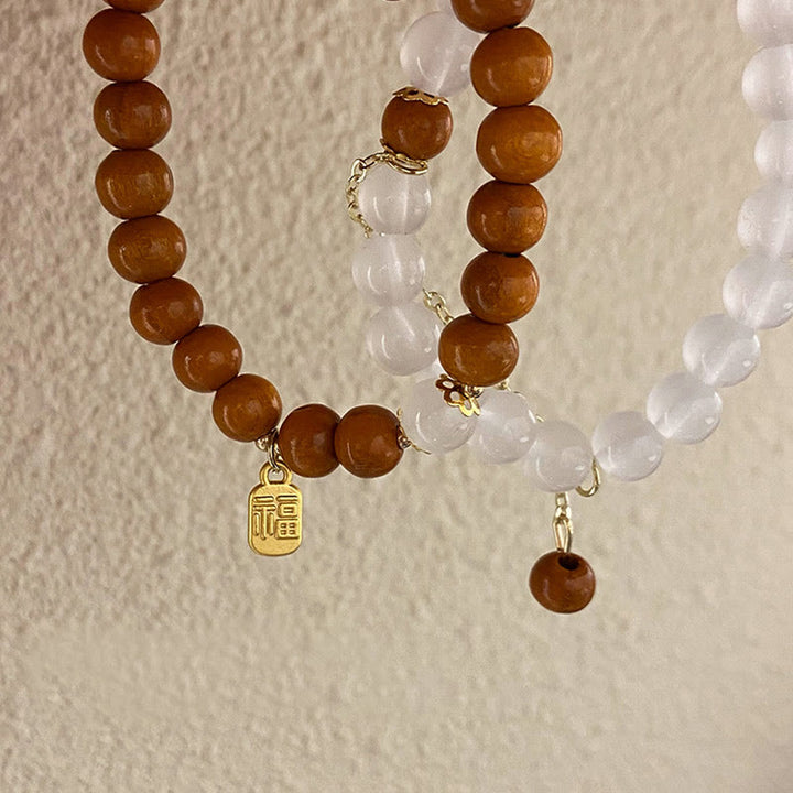 Buddha Stones Armband met bedeltje van sandelhout, kattenoog en Fu-figuur. - image 14