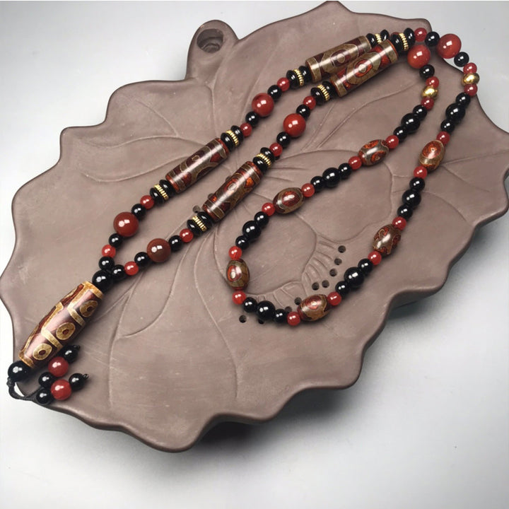 Buddha Stones Ketting met negenogen Dzi-kralen van rode agaat, symbool voor rijkdom en gezondheid. - image 0
