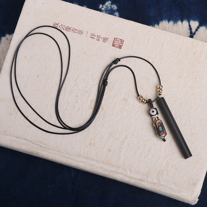 Ketting met Dzi-kralen van Tibetaans ebbenhout, symbool voor vrede en rust. - image 2