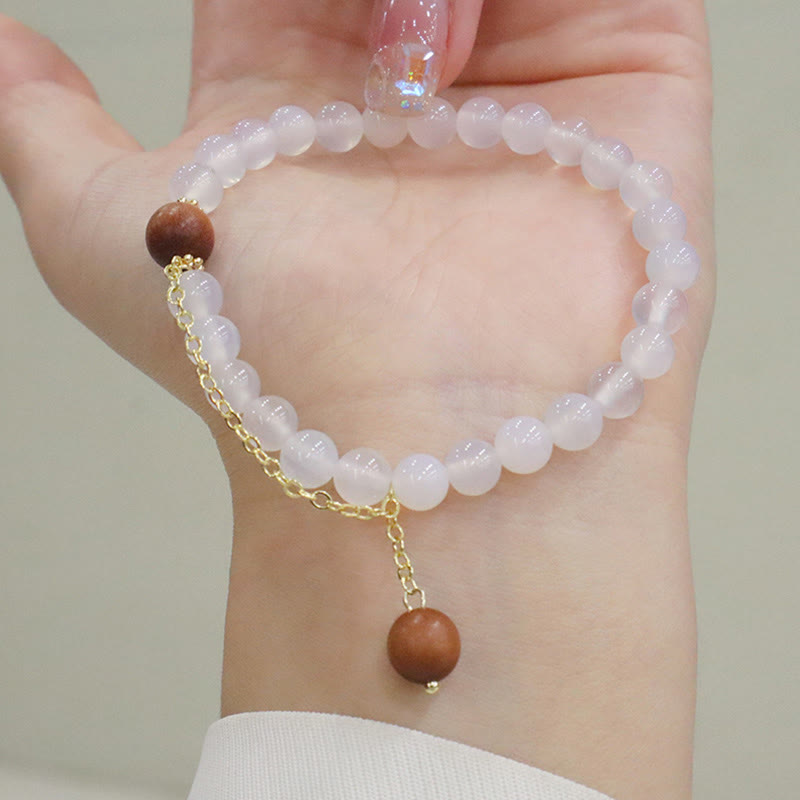 Buddha Stones Armband met bedeltje van sandelhout, kattenoog en Fu-figuur. - image 10