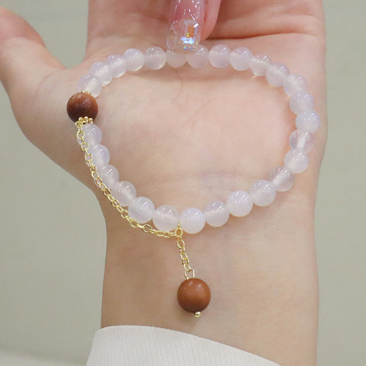 Buddha Stones Armband met bedeltje van sandelhout, kattenoog en Fu-figuur. - image 10