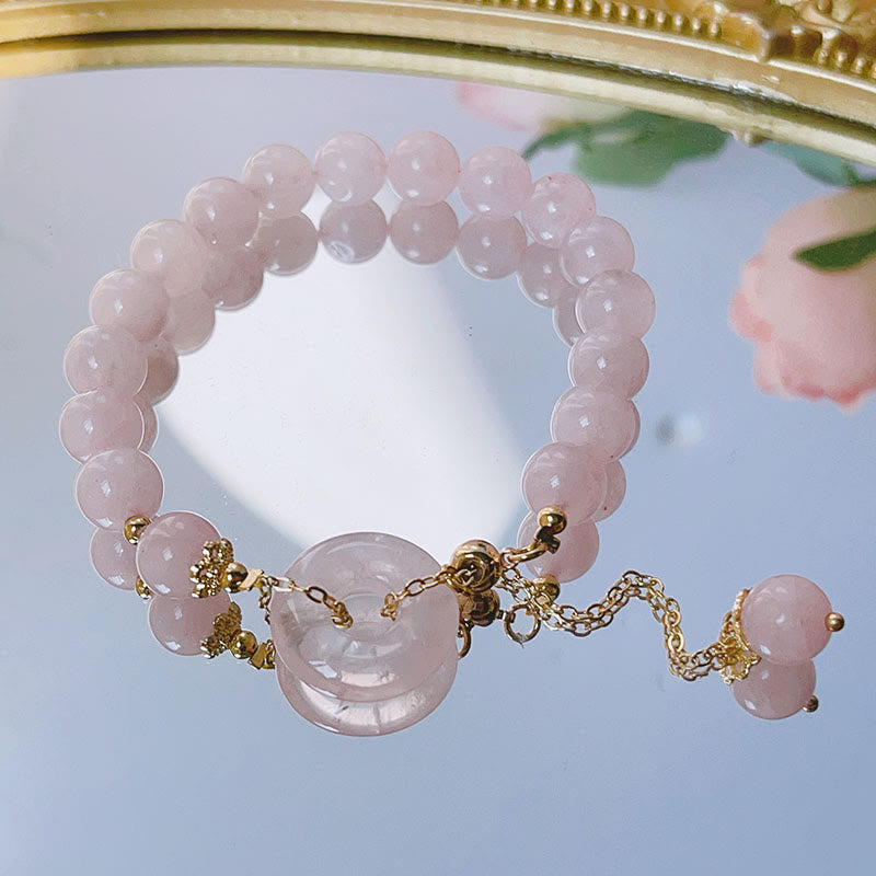 Buddha Stones Armband met vredesgesp en liefdesbedeltje van natuurlijk roze kristal - image 1
