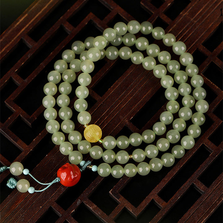 Buddha Stones Armband met lachende Boeddha, symbool van jade, rode agaat en amber. - image 9