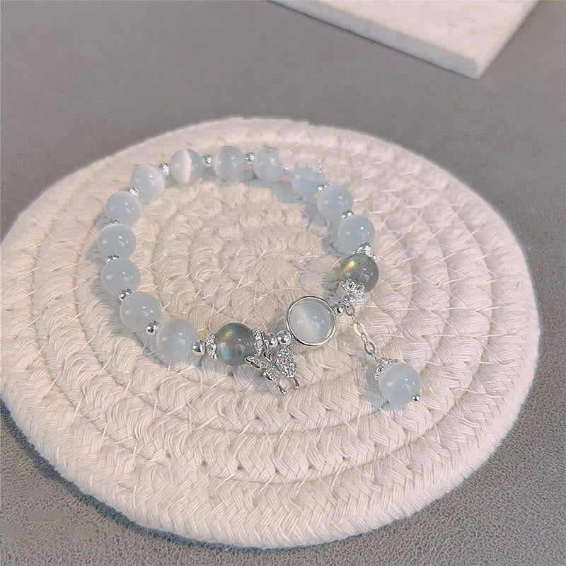 Buddha Stones Armband met bedeltjes van kattenoog, maansteen, vlinder en ster - image 5
