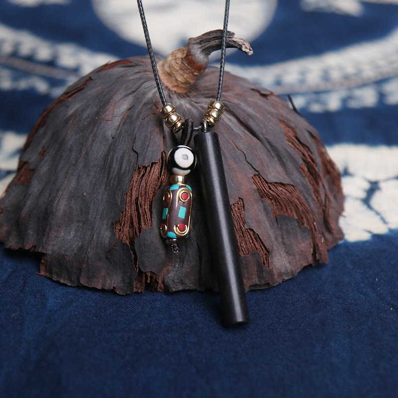 Ketting met Dzi-kralen van Tibetaans ebbenhout, symbool voor vrede en rust. - image 1