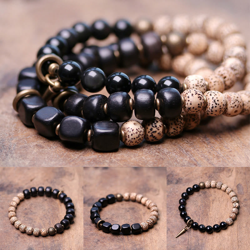 Buddha Stones Tibetaanse Bodhizaadarmband van zwarte obsidiaan , ebbenhout en koper - image 1