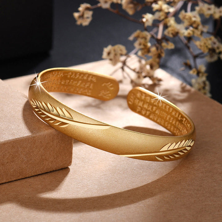 Buddha Stones Koperen Manchetarmband met gegraveerd patroon van een verenhart en Bangle . - Gouden Veer - image 0