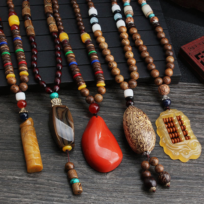 Buddha Stones Halskettinghanger van Tibetaans wengéhout met bodhi-agaat en een balans- en Ketting - image 0