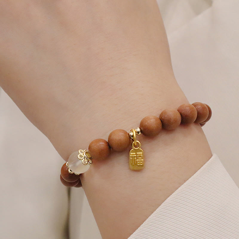 Buddha Stones Armband met bedeltje van sandelhout, kattenoog en Fu-figuur. - image 4