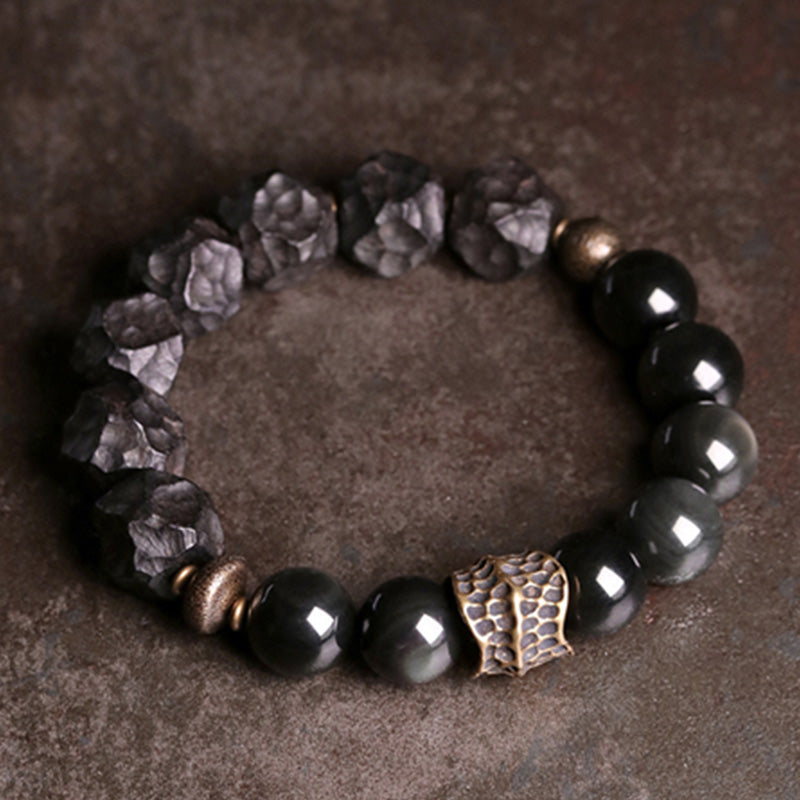 Buddha Stones Armband voor koppels, gemaakt van zwart obsidiaan, ebbenhout en koper. - image 1