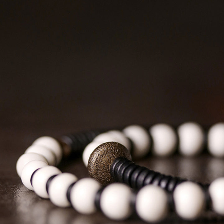 Buddha Stones Armband voor stellen, gemaakt van beenkralen, ebbenhout en koper. - image 8