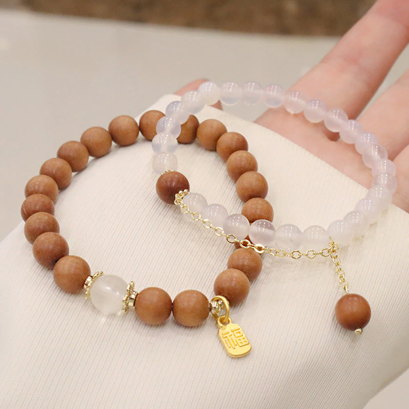Buddha Stones Armband met bedeltje van sandelhout, kattenoog en Fu-figuur. - image 13