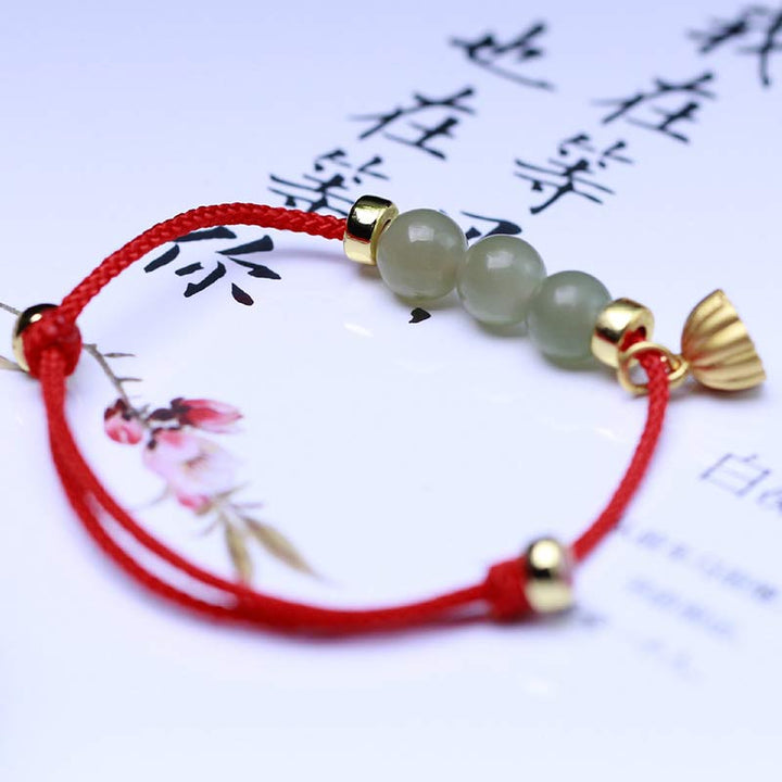 Buddha Stones Armband van natuurlijk jade, lotuszaad en rood koord. - image 4