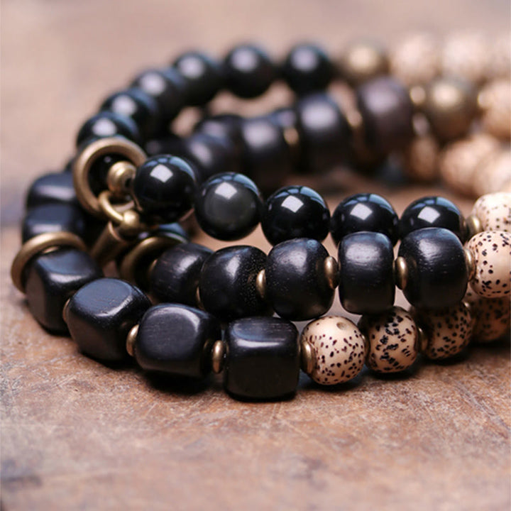 Buddha Stones Tibetaanse Bodhizaadarmband van zwarte obsidiaan , ebbenhout en koper - image 11