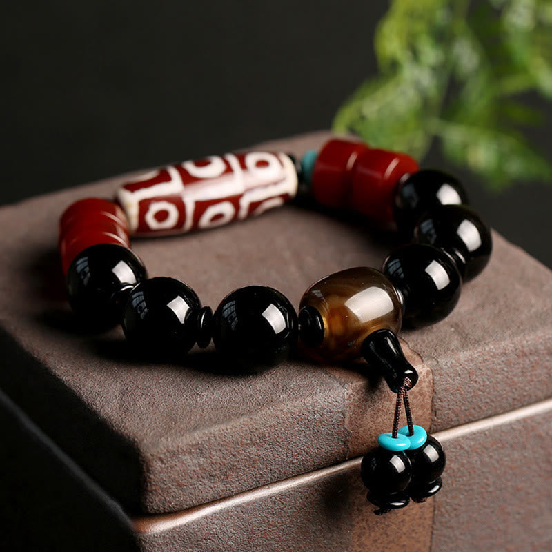 Buddha Stones Tibetaanse Armband met negen ogen (Dzi-kraal) en zwarte onyx voor bescherming van rijkdom. - Negenoog Dzi-kraal - image 0