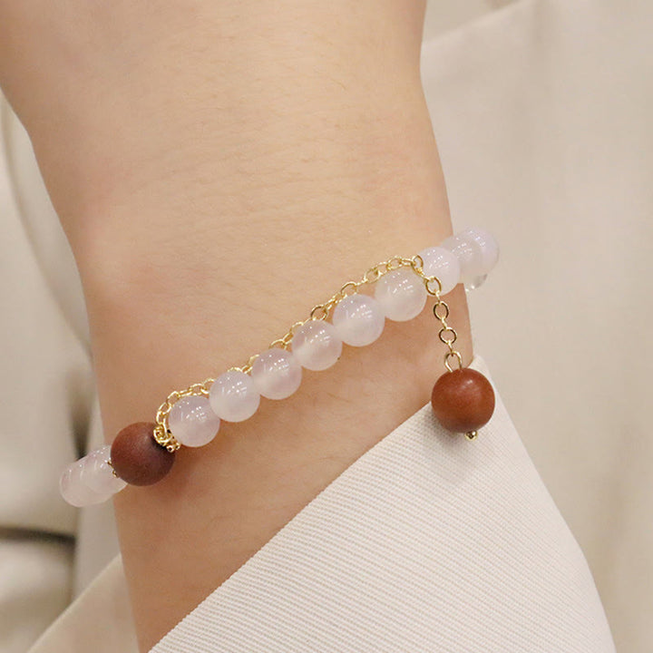 Buddha Stones Armband met bedeltje van sandelhout, kattenoog en Fu-figuur. - image 12