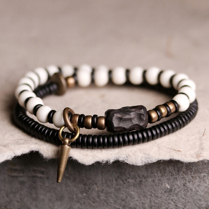 Buddha Stones Armband voor stellen, gemaakt van beenkralen, ebbenhout en koper. - 18 cm - image 0