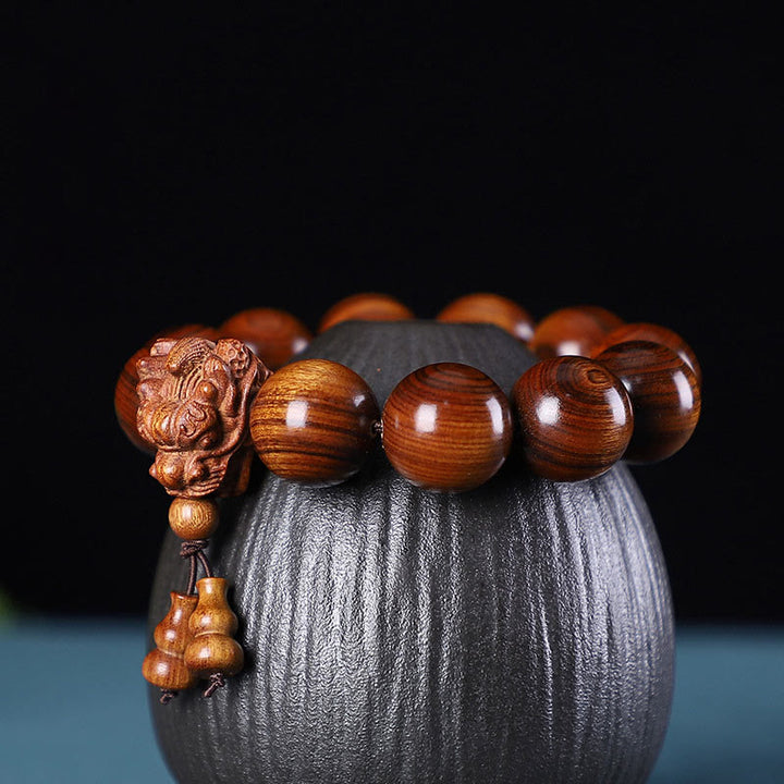 Buddha Stones Rozenhout, groene sandelhout, kleine bladeren, rode sandelhout, draak, gesneden Armband - Palissanderhout - image 0