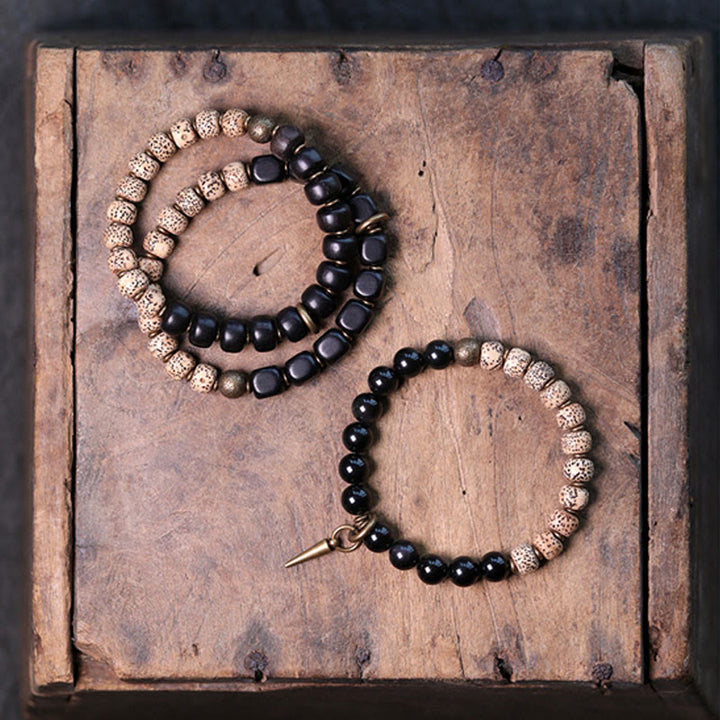 Buddha Stones Tibetaanse Bodhizaadarmband van zwarte obsidiaan , ebbenhout en koper - image 2
