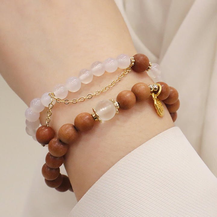 Buddha Stones Armband met bedeltje van sandelhout, kattenoog en Fu-figuur. - image 17