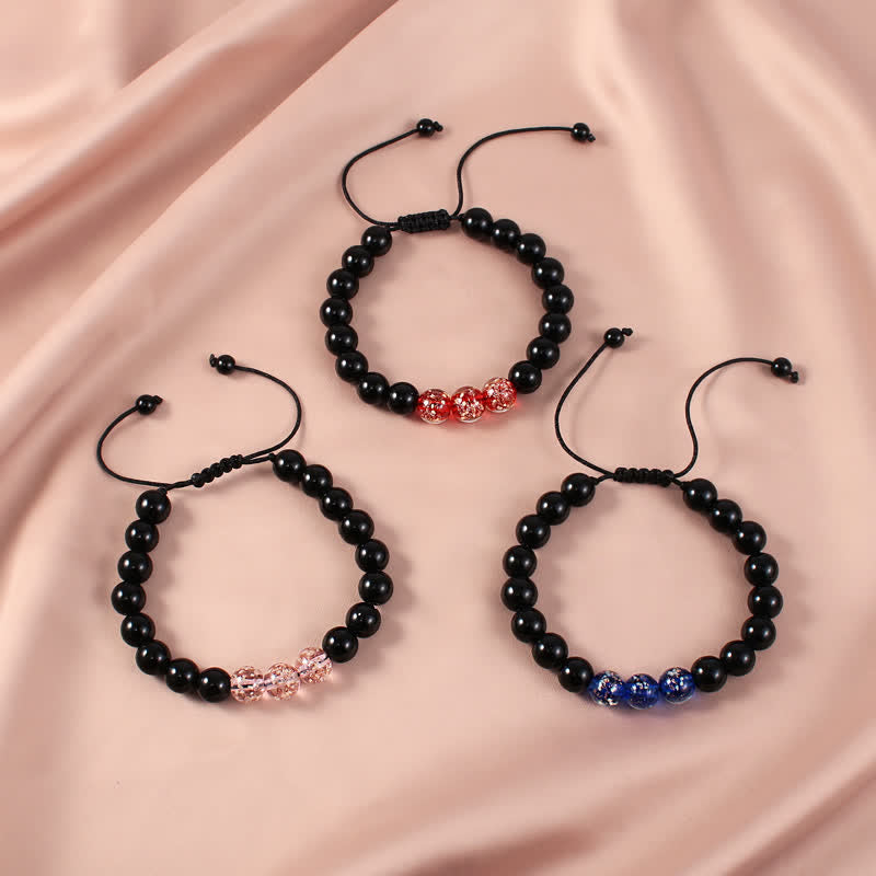 Buddha Stones Armband van zwarte obsidiaan met lichtgevende gloeisteen ter bevordering van kracht. - image 1