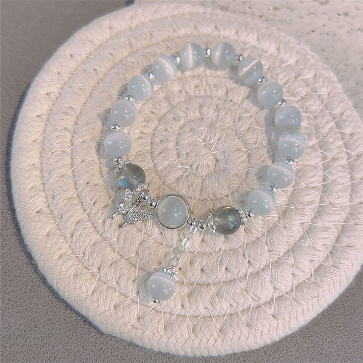 Buddha Stones Armband met bedeltjes van kattenoog, maansteen, vlinder en ster - image 4