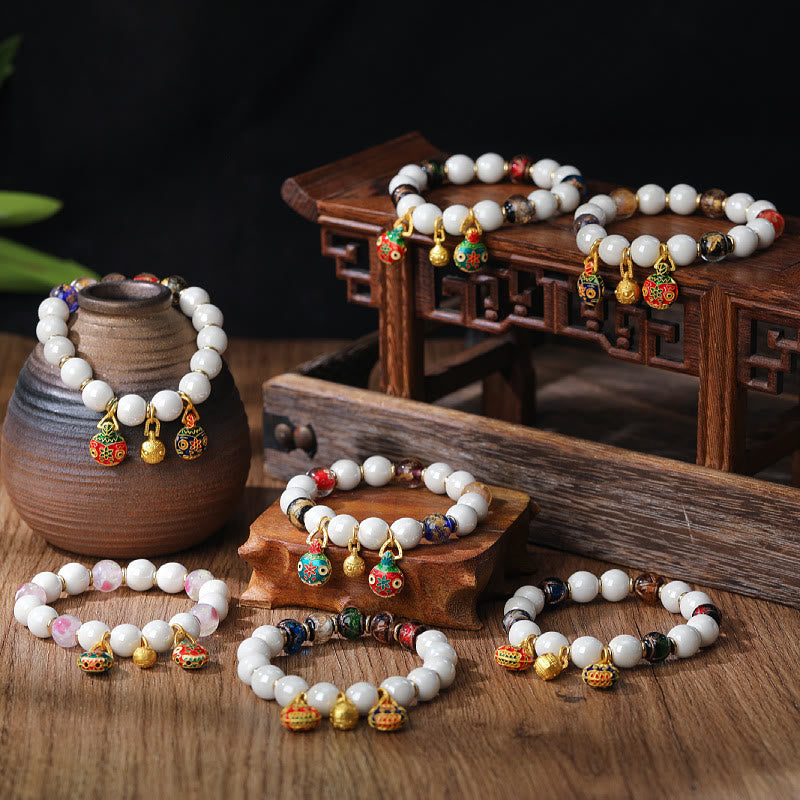 Buddha Stones Gouden geluksarmband met een afbeelding van een verslindend beest, gemaakt door Liuli Glass en kleurrijke porseleinen Armband. - image 0