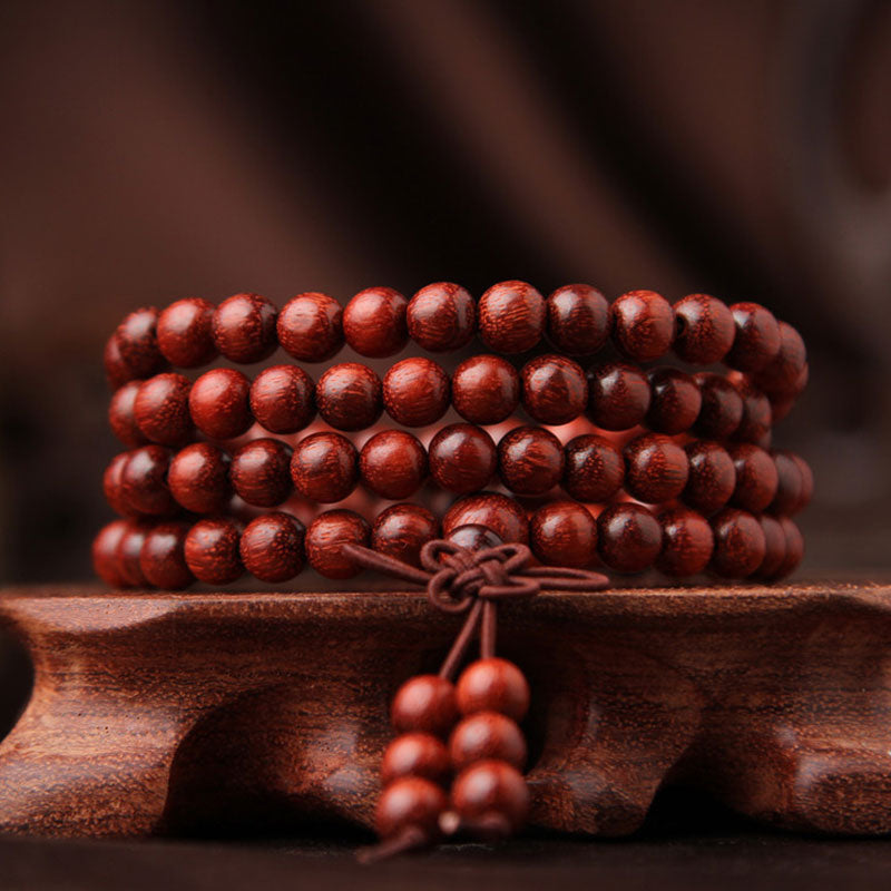 Buddha Stones Tibetaanse Mala - Armband met 108 kralen van rood sandelhout met kleine blaadjes. - image 0